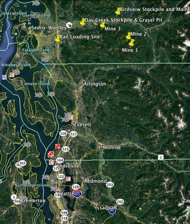 Regional map running from Sedro-Woolley in the north down to Seattle. Markers identify three mine sites in the eastern foothills, two stockpile sites, and a rail loading site, with Puget Sound, Whidbey and Camano islands and the Interstate 5 corridor to the west.